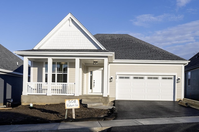 view of front of house with a garage and a porch