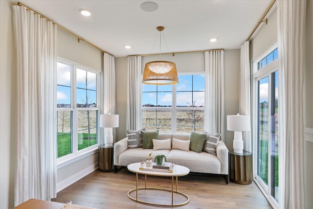 sitting room featuring light hardwood / wood-style flooring