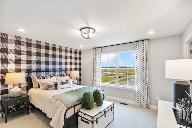 bedroom featuring light colored carpet