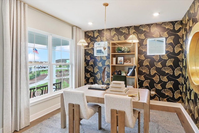 dining space with wood-type flooring