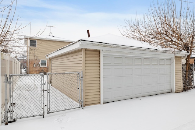 view of snow covered garage