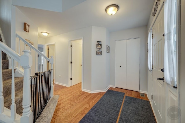 entryway with light hardwood / wood-style flooring