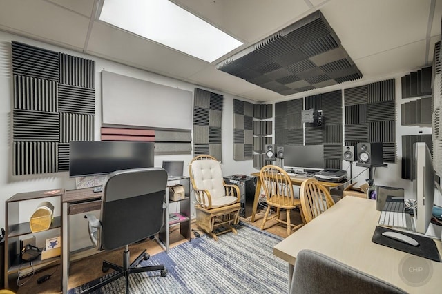 office space with a paneled ceiling