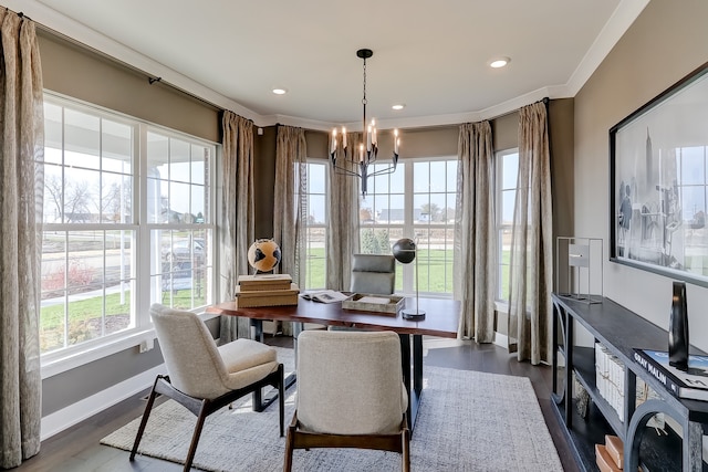 dining area with ornamental molding, an inviting chandelier, and dark wood-type flooring