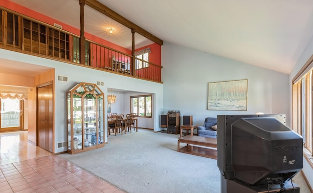 living room featuring beam ceiling, carpet floors, high vaulted ceiling, and an inviting chandelier