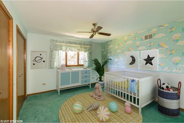 bedroom featuring carpet floors, a closet, a nursery area, and ceiling fan