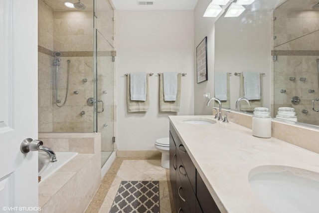 full bathroom featuring vanity, separate shower and tub, tile patterned floors, and toilet