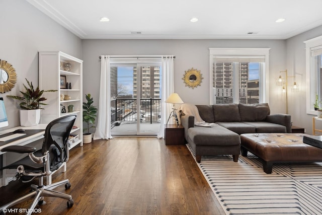 interior space with plenty of natural light and dark hardwood / wood-style flooring