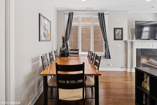 dining space featuring dark hardwood / wood-style flooring