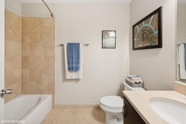 full bathroom featuring tile patterned floors, vanity, tiled shower / bath combo, and toilet