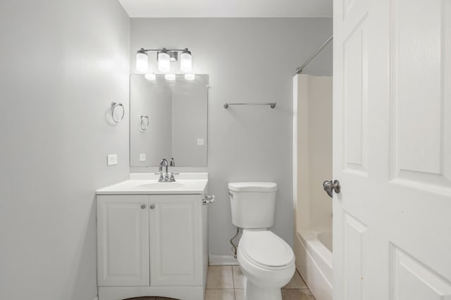 full bathroom featuring tile patterned floors, vanity, toilet, and tub / shower combination