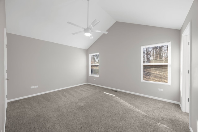 unfurnished room featuring carpet flooring, ceiling fan, and vaulted ceiling