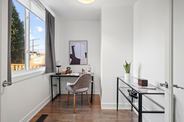 office space with dark hardwood / wood-style flooring