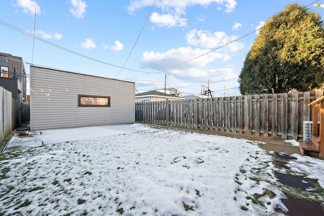 view of yard layered in snow