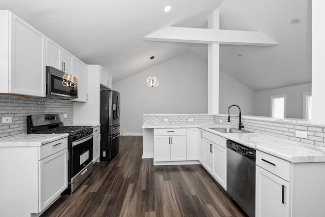 kitchen featuring kitchen peninsula, sink, vaulted ceiling with beams, appliances with stainless steel finishes, and white cabinetry