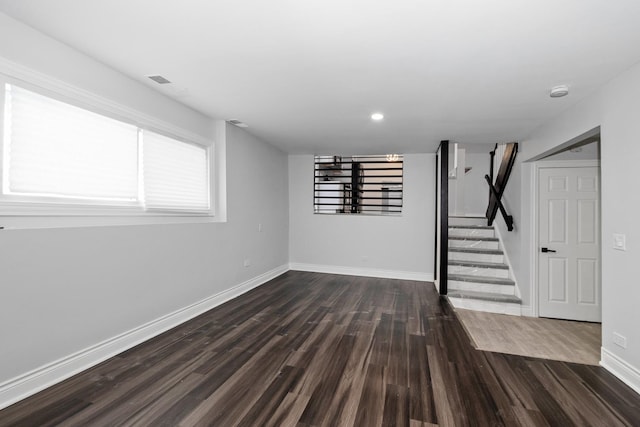 basement featuring dark hardwood / wood-style floors