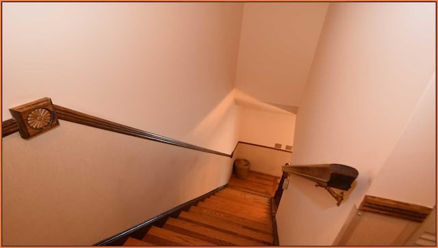 stairway featuring hardwood / wood-style floors