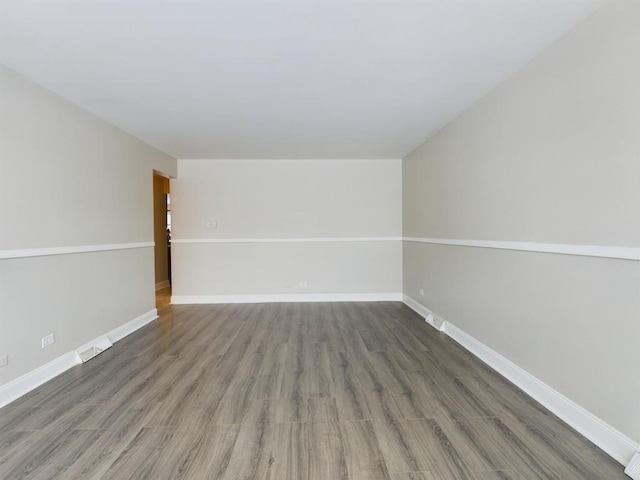 empty room featuring dark hardwood / wood-style floors