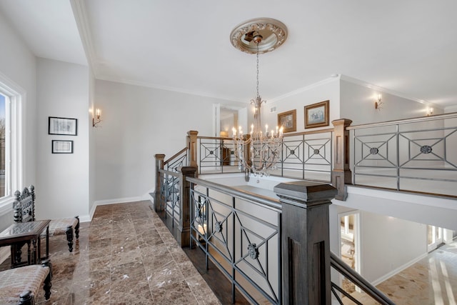 hallway with crown molding and a notable chandelier