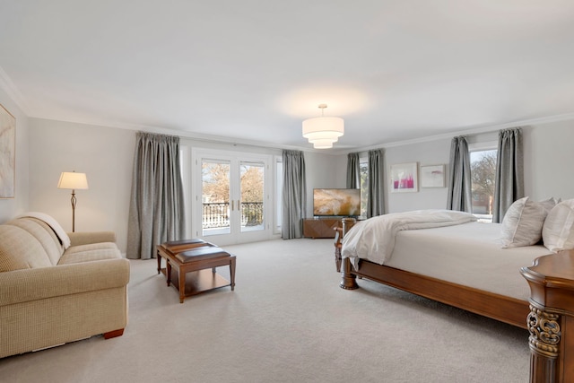 carpeted bedroom featuring french doors, ornamental molding, access to exterior, and multiple windows