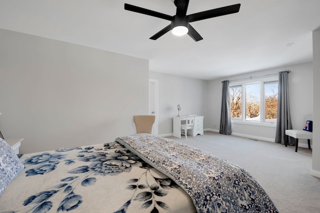 bedroom with ceiling fan and light colored carpet