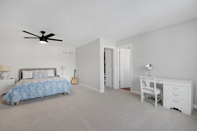 bedroom with ceiling fan and light colored carpet