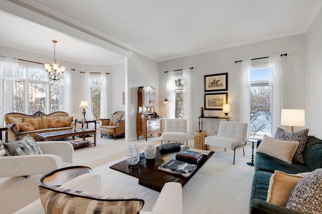 living room with ornamental molding, a notable chandelier, and carpet flooring