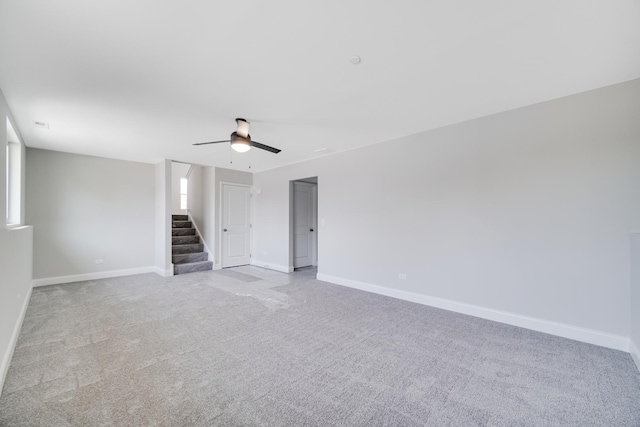 interior space with ceiling fan