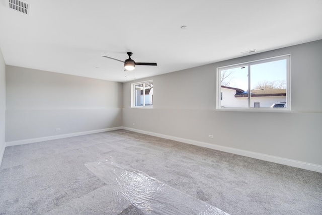 unfurnished room featuring carpet flooring and ceiling fan