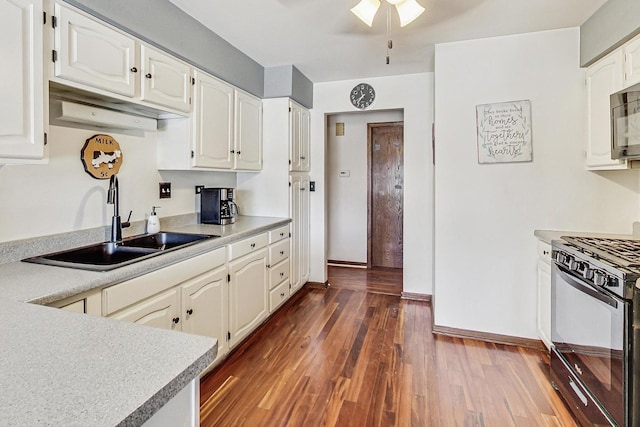 kitchen featuring dark hardwood / wood-style floors, sink, white cabinets, and black range with gas cooktop