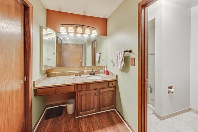 bathroom featuring hardwood / wood-style flooring and vanity