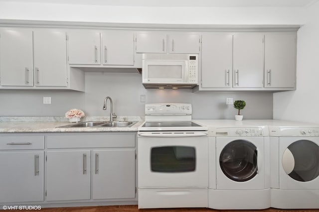 laundry room featuring independent washer and dryer and sink