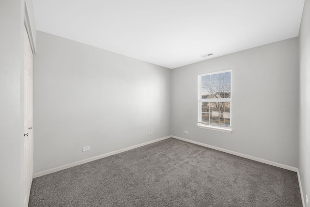 unfurnished room with carpet floors