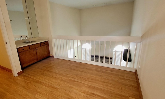 interior space featuring sink and light wood-type flooring