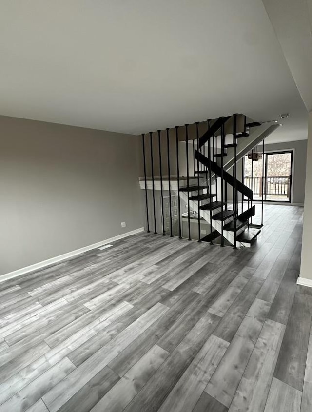 stairs with hardwood / wood-style flooring