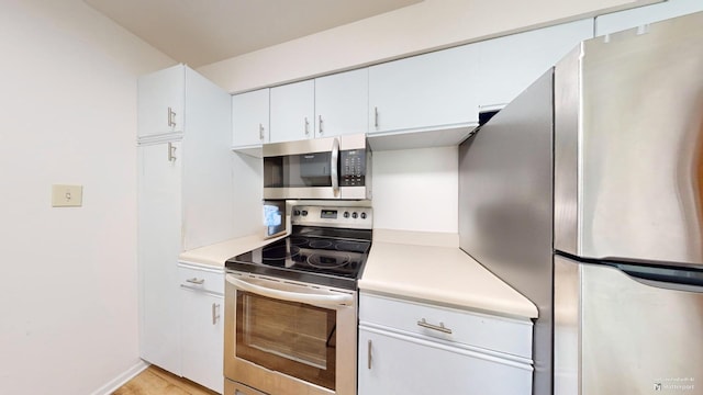 kitchen featuring white cabinets and stainless steel appliances