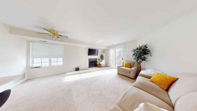 living room featuring ceiling fan and light carpet