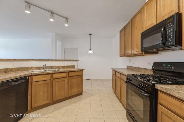 kitchen featuring black appliances, decorative light fixtures, light tile patterned floors, and sink