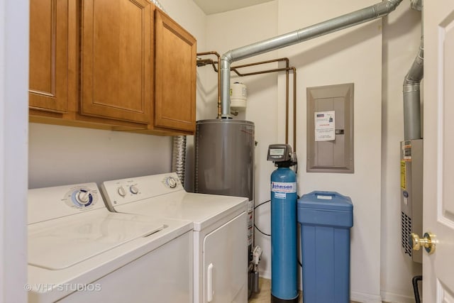 washroom with gas water heater, cabinets, separate washer and dryer, and electric panel