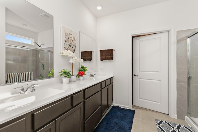 bathroom with vanity, tile patterned flooring, and a shower with door