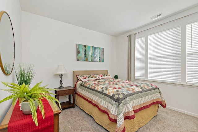 bedroom with light colored carpet