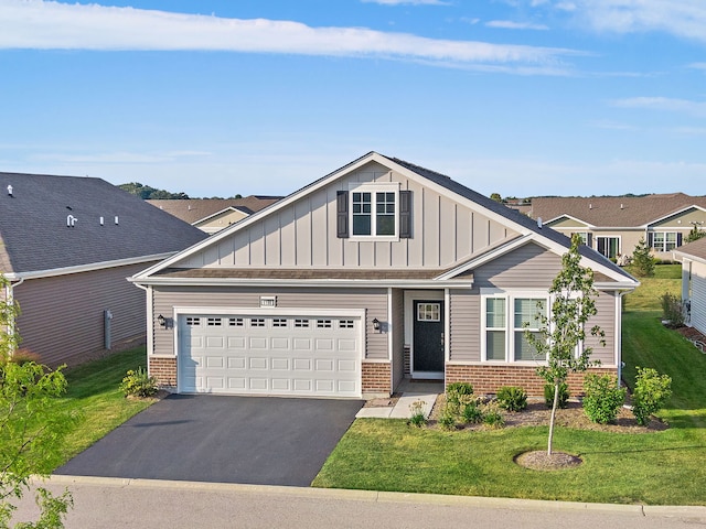 view of front of property with a garage and a front lawn