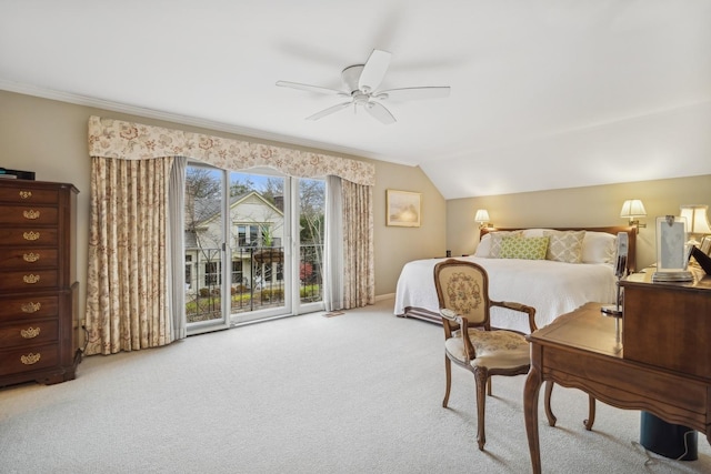 bedroom featuring ceiling fan, carpet, access to exterior, vaulted ceiling, and ornamental molding