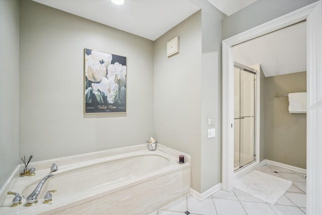 bathroom with tile patterned floors and separate shower and tub