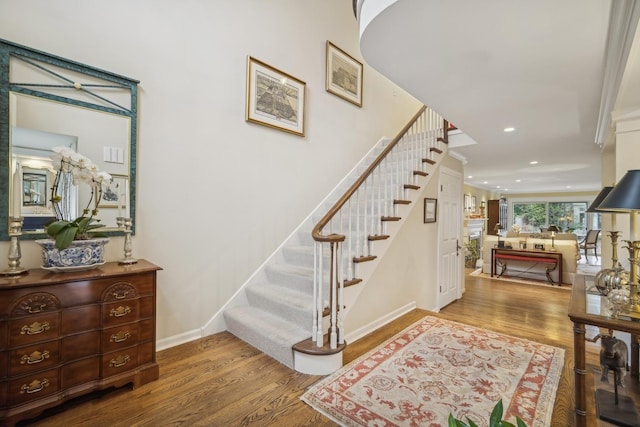 stairs with hardwood / wood-style flooring