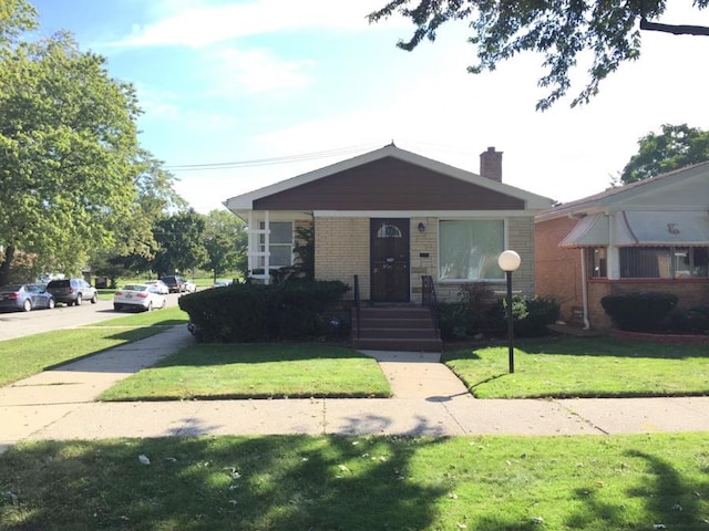 bungalow with a front lawn