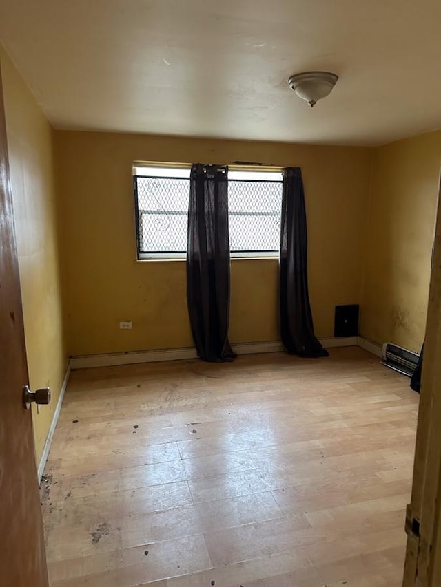 empty room with light wood-type flooring