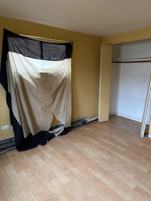 unfurnished bedroom featuring light hardwood / wood-style floors