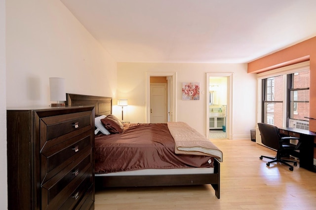 bedroom with light hardwood / wood-style floors