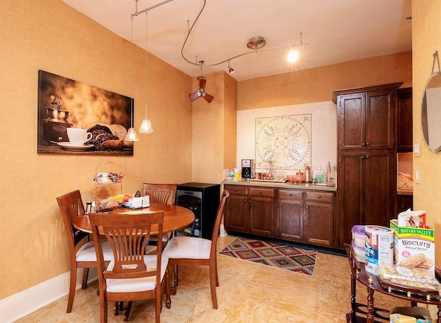 dining room featuring rail lighting